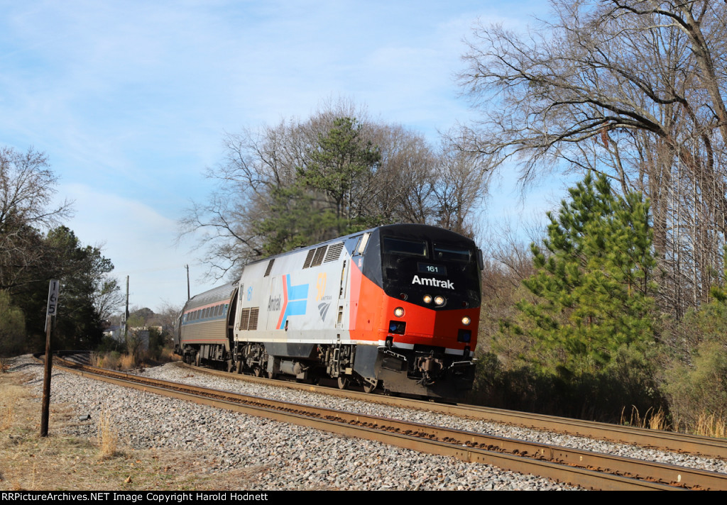 AMTK 161 leads train P080-05 away from the station